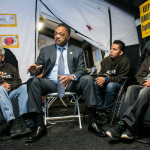 In a tent on the National Mall, the Rev. Jesse Jackson spoke with, from left, Eliseo Medina, Cristian Avila and Dae Joong Yoon. Photo: T.J. Kirkpatrick for The NY Times